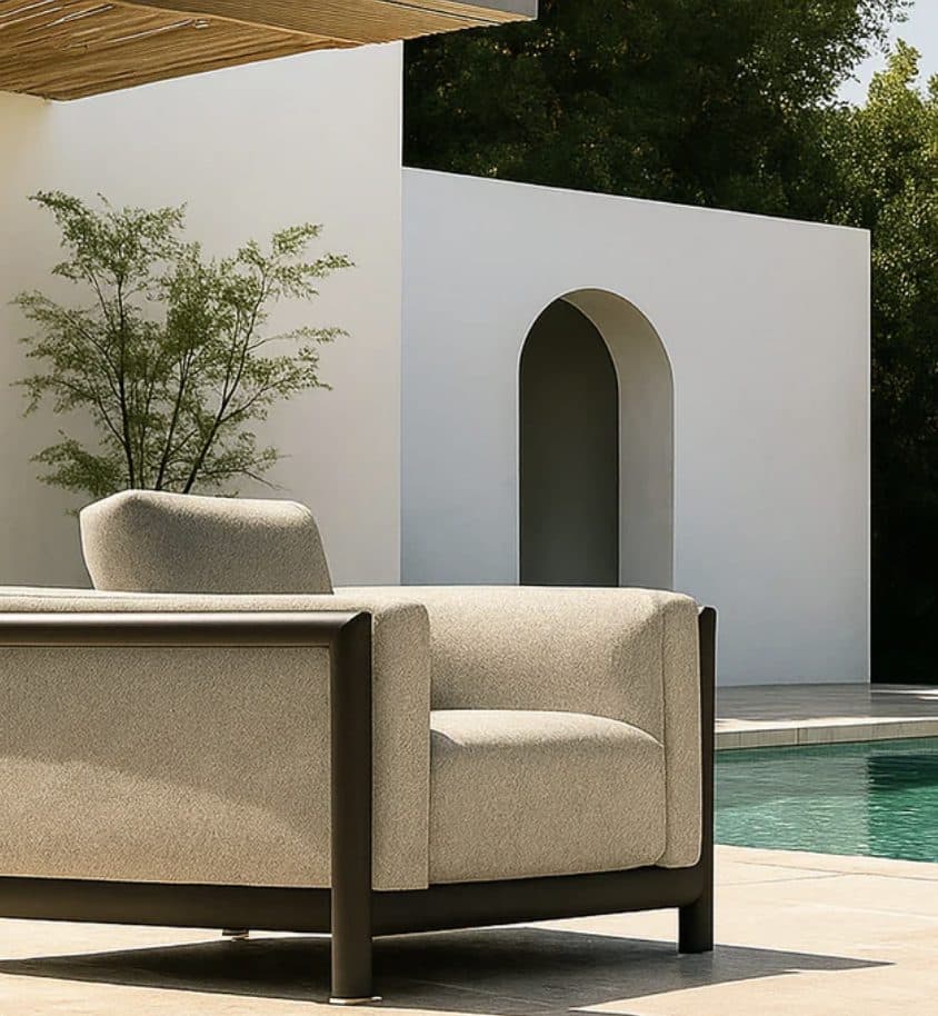 Maze Outdoor — boucle armchair on a poolside terrace