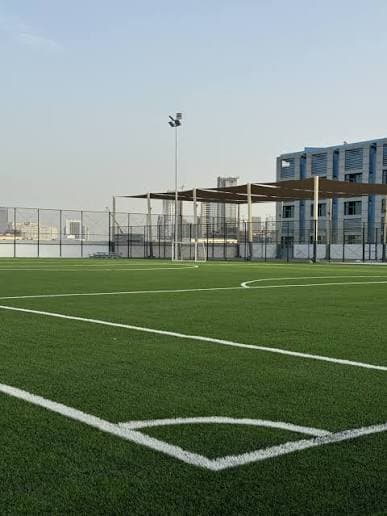 Maze football pitch on a Dubai rooftop with fresh line markings