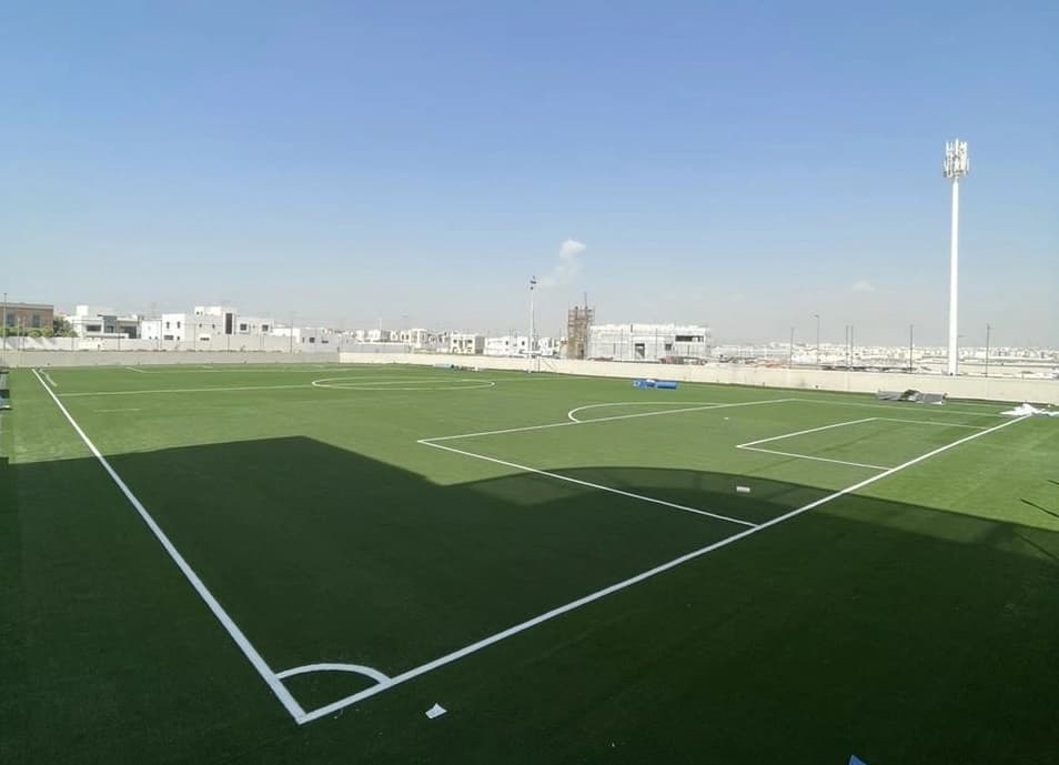 Full-size Maze football pitch in daylight with floodlight mast