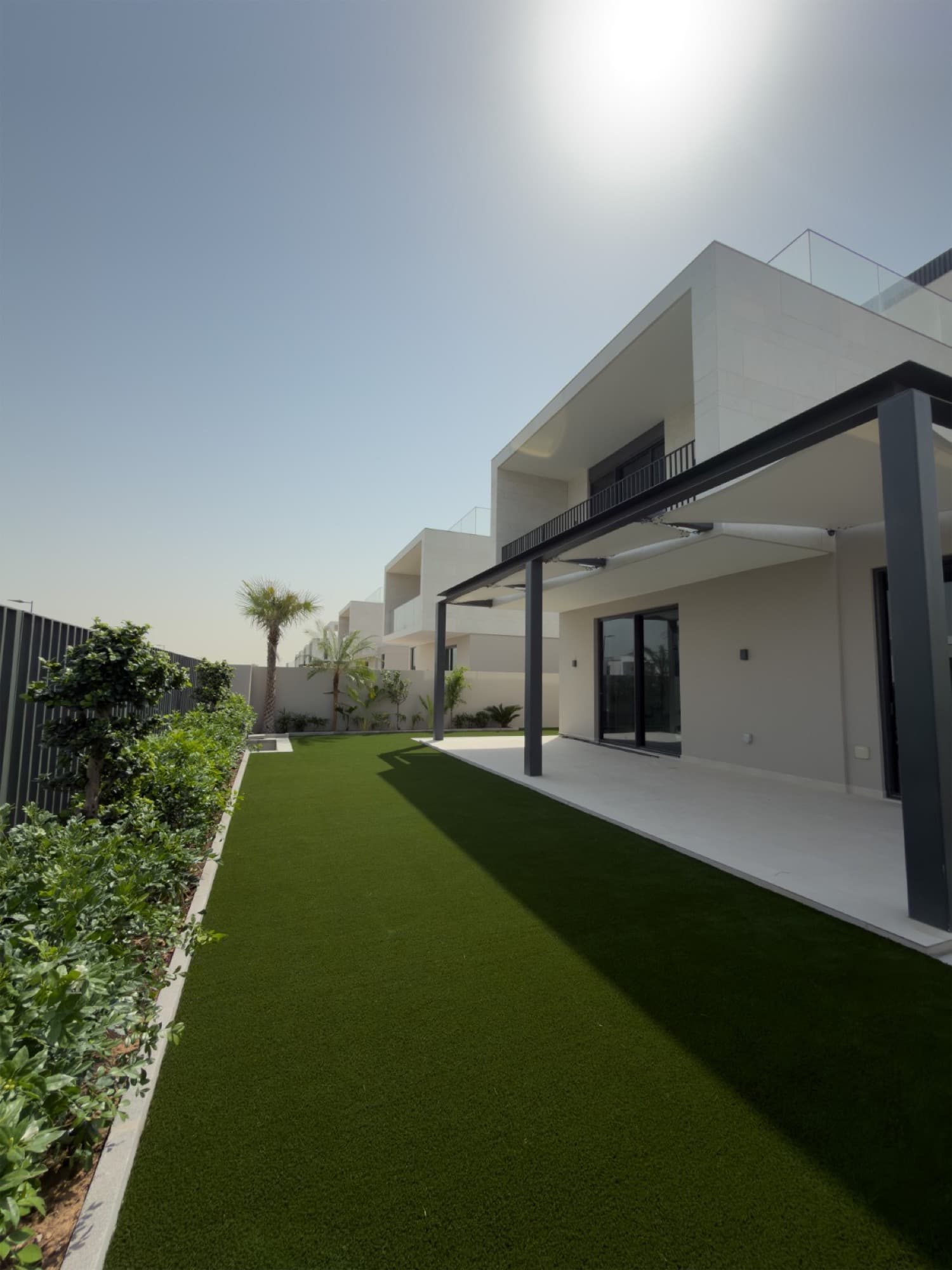 Family enjoying their finished artificial grass lawn